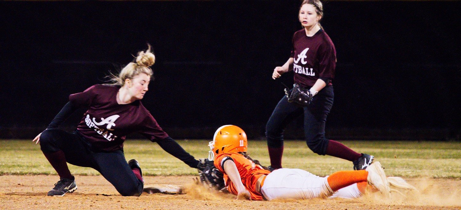 Carmyn Heim successfully steals second base. [check these out, bag a print]